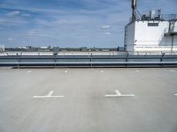 there is a blue sky in the background of this picture, an industrial facility has a large metal pipe and water treatment system