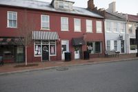 Urban Cityscape: Brick Wall and Asphalt Road