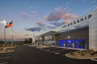 a building with the words friendship on it with a large american flag at the top