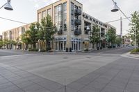 a building and street corner is featured in an urban setting setting with a cloudy sky