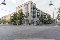 a building and street corner is featured in an urban setting setting with a cloudy sky