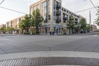 a building and street corner is featured in an urban setting setting with a cloudy sky