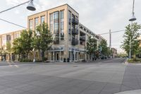 a building and street corner is featured in an urban setting setting with a cloudy sky