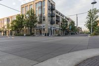 a building and street corner is featured in an urban setting setting with a cloudy sky