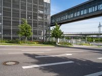 a highway and street view in an urban city with buildings and trees in the background