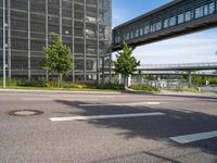 a highway and street view in an urban city with buildings and trees in the background