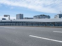 Urban Cityscape of Japan: Daytime Views with Clouds and Bridges