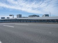 Urban Cityscape of Japan: Daytime Views with Clouds and Bridges