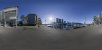 three pictures, taken from a fish eye view, depicting urban buildings and water with sunlight