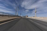 the view of a freeway highway from inside a vehicle driving in the foreground is blurredry