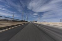 the view of a freeway highway from inside a vehicle driving in the foreground is blurredry