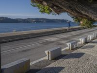 there are many grey concrete blocks next to the water of the ocean that are lined up along