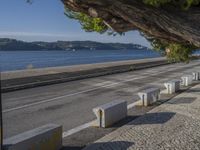 there are many grey concrete blocks next to the water of the ocean that are lined up along