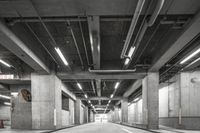 an empty parking garage has multiple spots for people to ride in the way through it