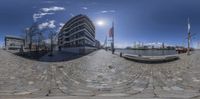 the fish eye view of an urban courtyard and buildings from a full tilt lens view