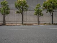 empty road with white lines on the streets of city area against cloudy blue sky on a sunny day