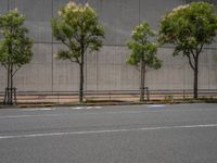 empty road with white lines on the streets of city area against cloudy blue sky on a sunny day