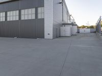 the garage in an industrial building is painted grey and has glass doors with a fire hydrant