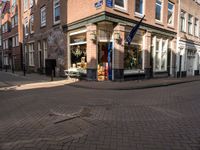 a brick road leads to a large store with a sign on the corner reading'go to bed '