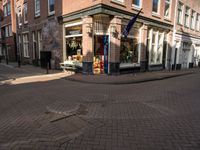 a brick road leads to a large store with a sign on the corner reading'go to bed '