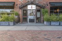 this is the exterior of a restaurant, showing off the front entrance of it and two windowed front doors