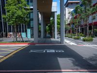 a red crosswalk sits next to tall buildings in an urban area, near a pedestrian crossing