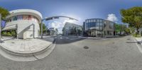 the panorama captures an image of the buildings near the road, and one view of the street shows an outside area, where the building and is also is very modern