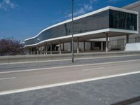 a street with a long building on both sides and no one standing on the side