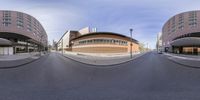 a wide angle view of a street through a spherical lens, showing what to see