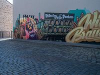 a truck in front of a large sign for the brewery wild budaic on the side of a wall