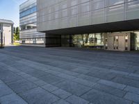 an empty courtyard of some kind of public building near a building's entryway