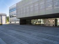 an empty courtyard of some kind of public building near a building's entryway