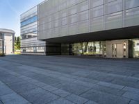 an empty courtyard of some kind of public building near a building's entryway