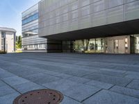 an empty courtyard of some kind of public building near a building's entryway