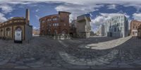 there are many buildings seen in this 360 - view image of them with one street light near the front