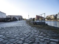 Urban Design in Berlin: Cobblestone Flooring and Courtyard Overlooking the River