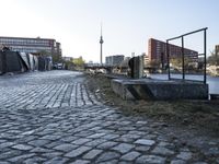 Urban Design in Berlin: Cobblestone Flooring and Courtyard Overlooking the River