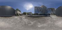 360 - view of building near a water feature in the desert by day on a sunny day