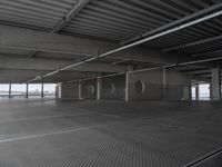 a parking garage with a ramp and several round spaces for bikes to move through it