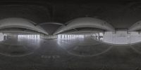 a big building with three mirrors and the floor still covered in graffiti on the floor