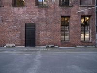 a red brick building is shown in this image as well as the windows and doors are visible