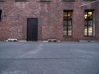 a red brick building is shown in this image as well as the windows and doors are visible