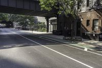 Urban Design with Buildings and Trees on Asphalt Road