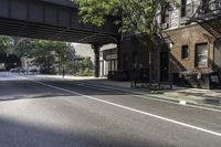 Urban Design with Buildings and Trees on Asphalt Road