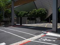 the yellow stop sign is on the side of the road in the city with no cars