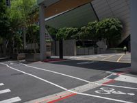 the yellow stop sign is on the side of the road in the city with no cars