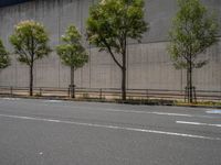 empty road with white lines on the streets of city area against cloudy blue sky on a sunny day