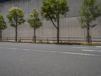 empty road with white lines on the streets of city area against cloudy blue sky on a sunny day