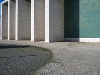 there are several columns outside a building that can be seen through a doorway in the picture