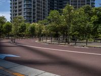 empty road with white lines on the streets of city area against cloudy blue sky on a sunny day